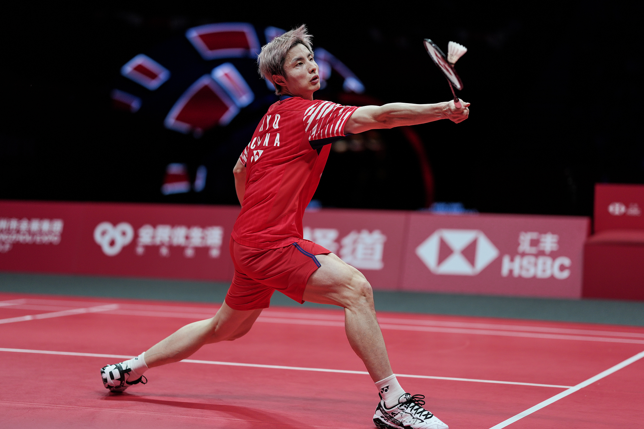 Shi Yuqi of China hits a shot against Li Shifeng of China in their men's singles opening match at the BWF (Badminton World Federation) World Tour Finals in Hangzhou, east China's Zhejiang Province, December 17, 2025. /VCG