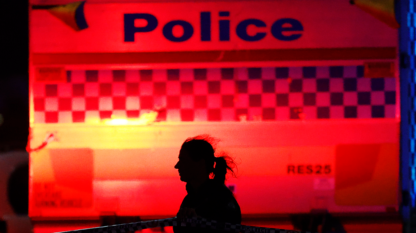 A police officer walks along cordon tapeline at the scene of a mass shooting at Bondi Beach in Sydney, Australia, December 14, 2025. /VCG