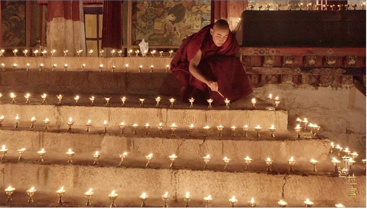 A monk lights butter lamps during the Butter Lamp Festival at the Sera Monastery in Lhasa, Xizang Autonomous Region, December 14, 2025. /CGTN