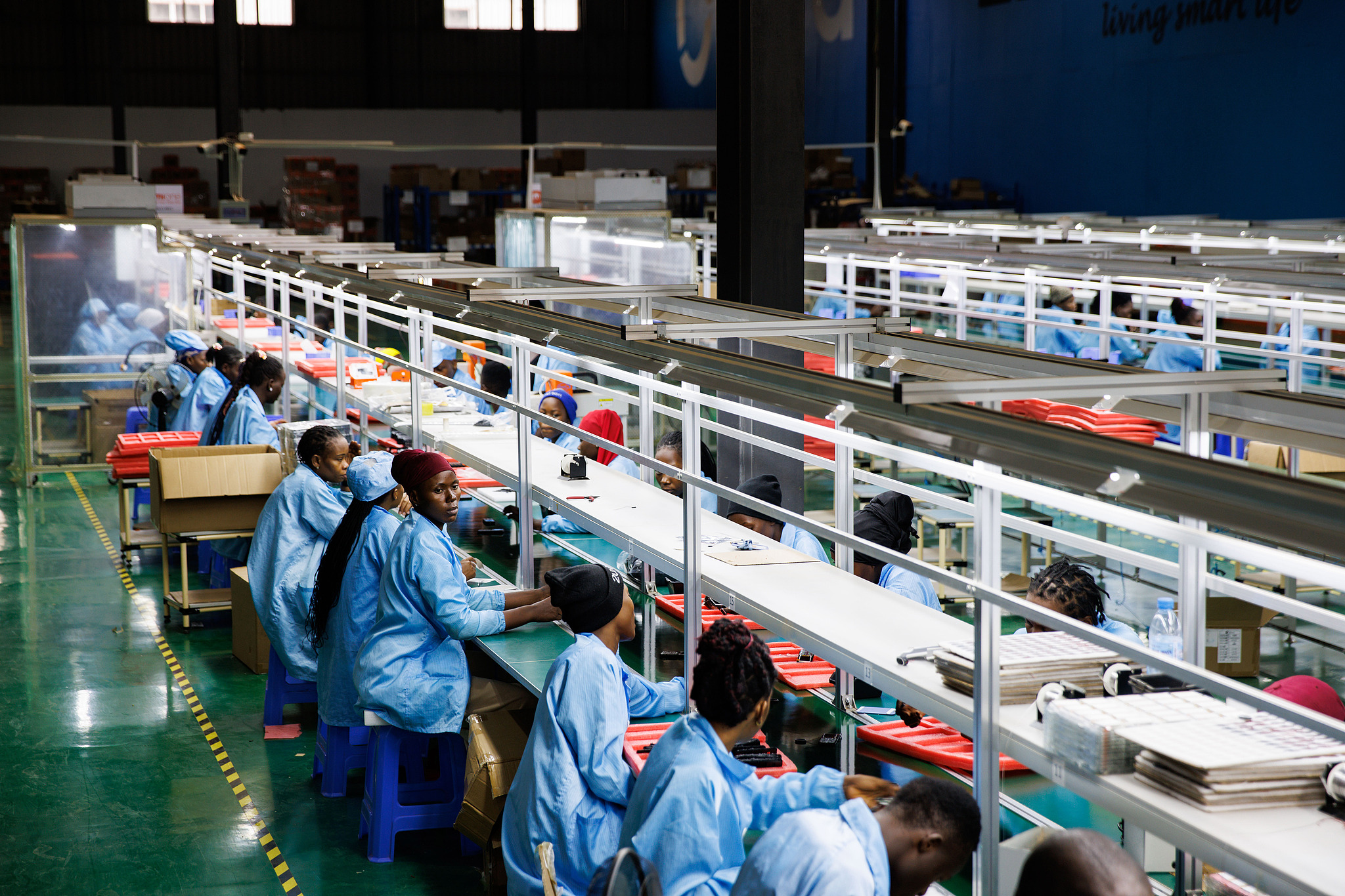 Workers assemble mobile phones at the MiOne factory in the Sino-Uganda Mbale Industrial Park in Mbale, Uganda, January 24, 2024. /CFP