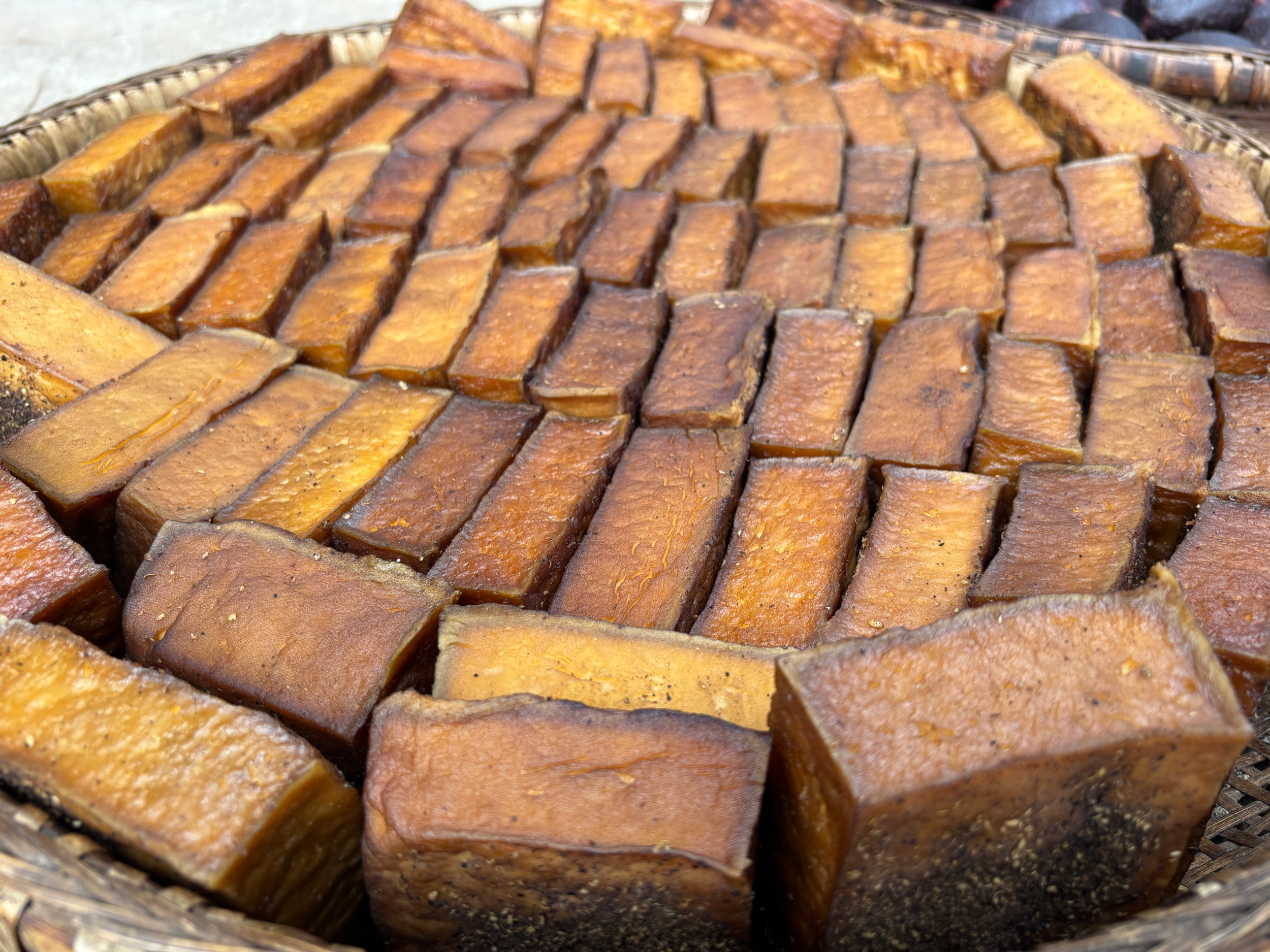 Traditional smoked tofu is seen in Laozhai Village, Yuping Dong Autonomous County, southwest China's Guizhou Province, on December 17, 2025. /Tongren Media Convergence Center