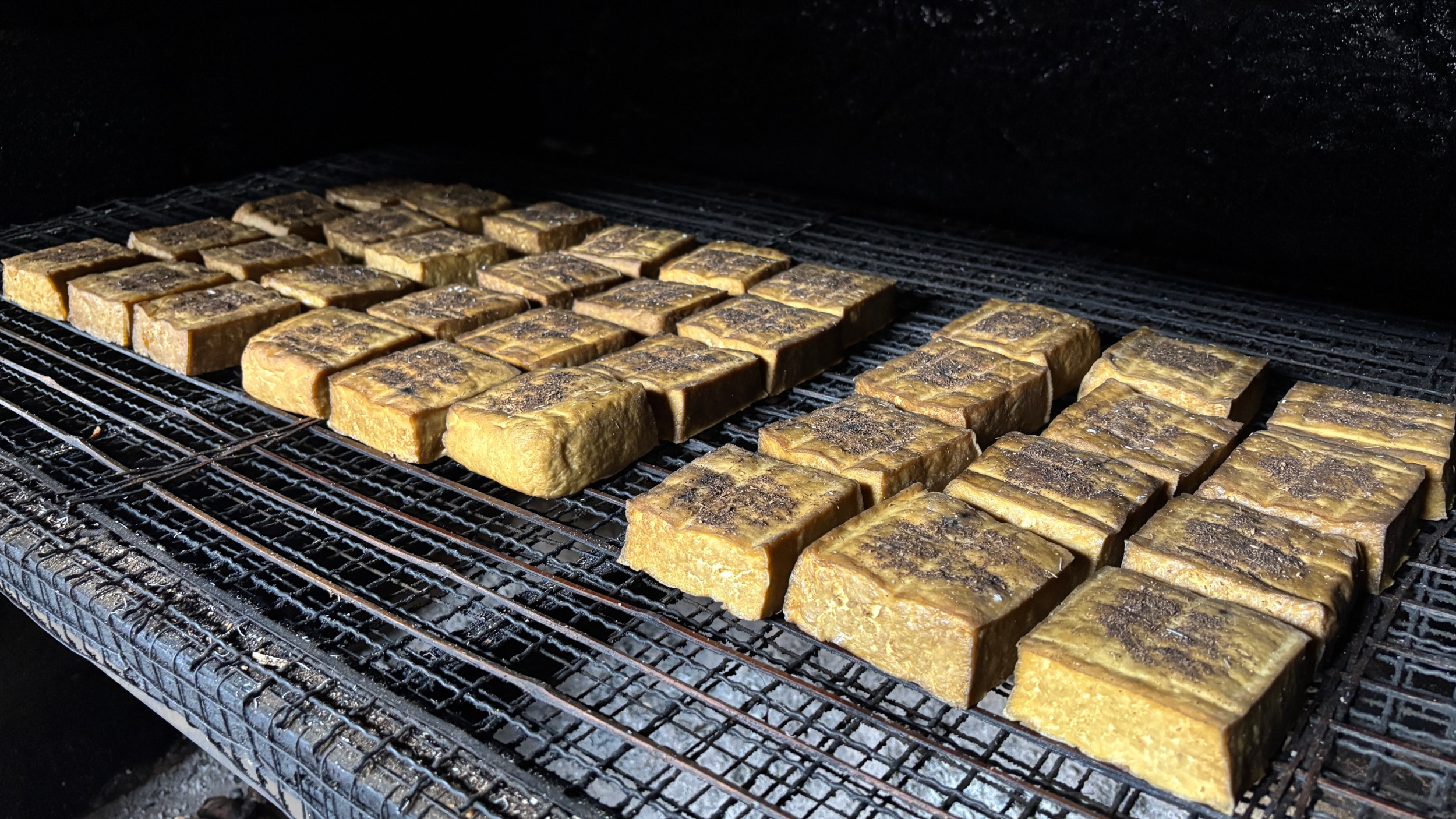 Tofu is smoked in Laozhai Village, Yuping Dong Autonomous County, southwest China's Guizhou Province, on December 17, 2025. /Tongren Media Convergence Center