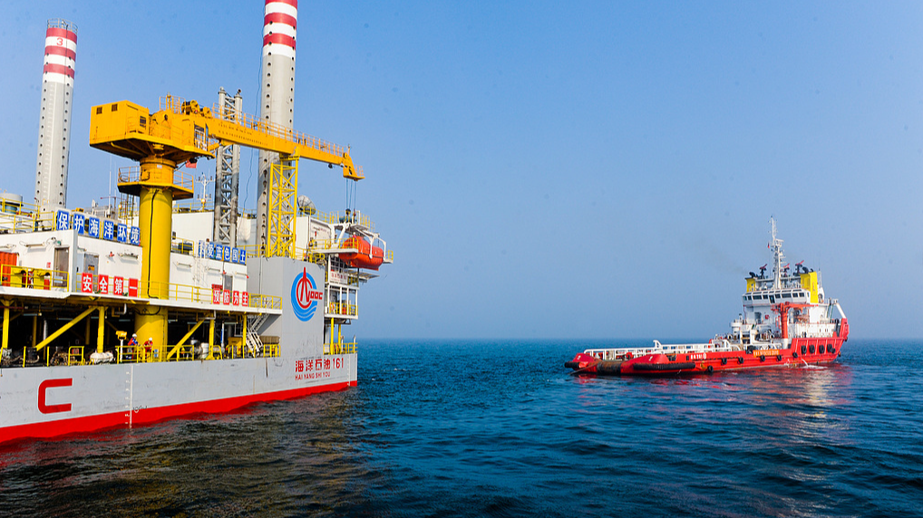 An offshore multi-purpose service vessel completes operations on an offshore oil platform in the Bohai Sea, China. / VCG