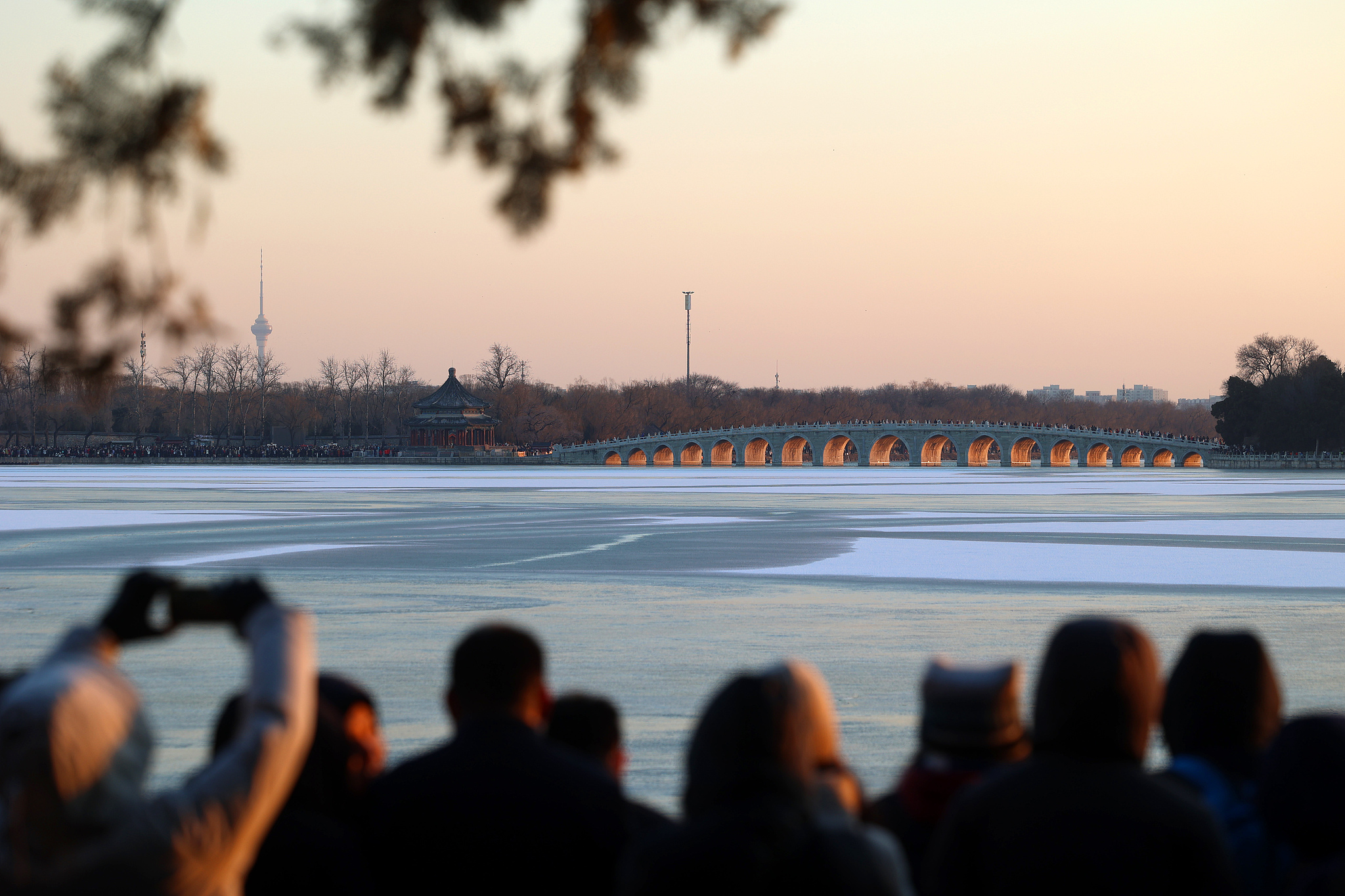 Beijing's iconic Summer Palace bridge glows on winter solstice