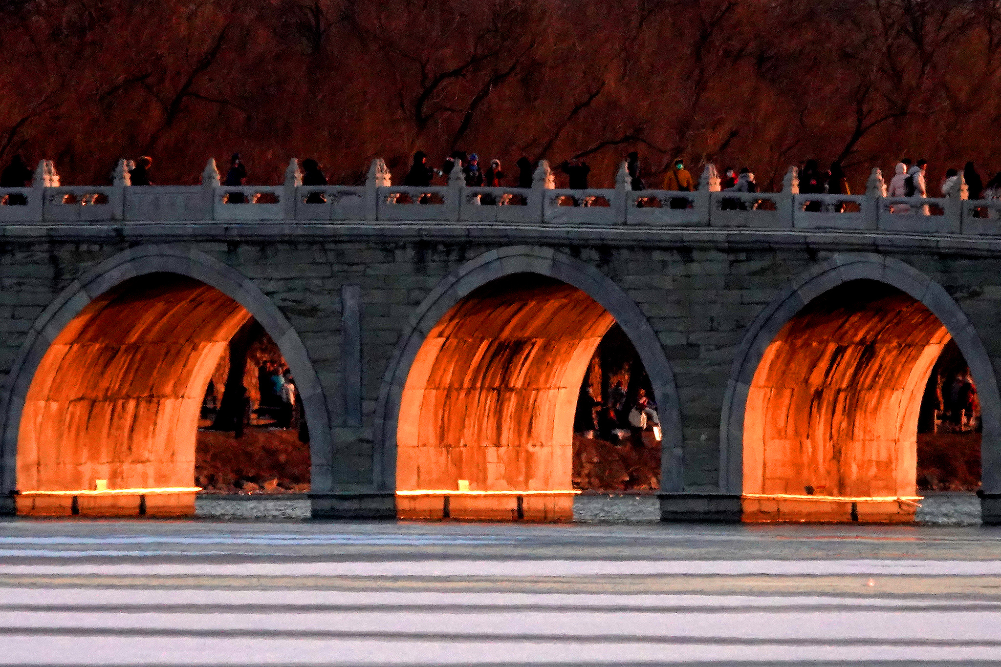 Beijing's iconic Summer Palace bridge glows on winter solstice
