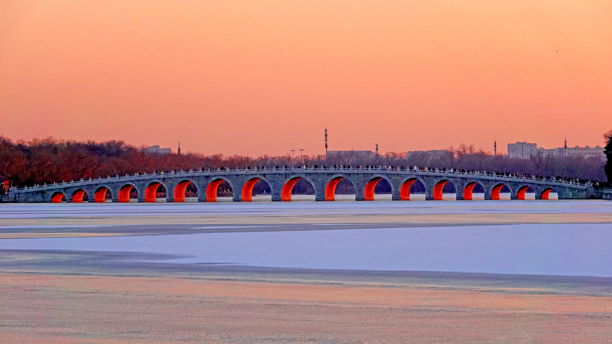 Beijing's iconic Summer Palace bridge glows on winter solstice