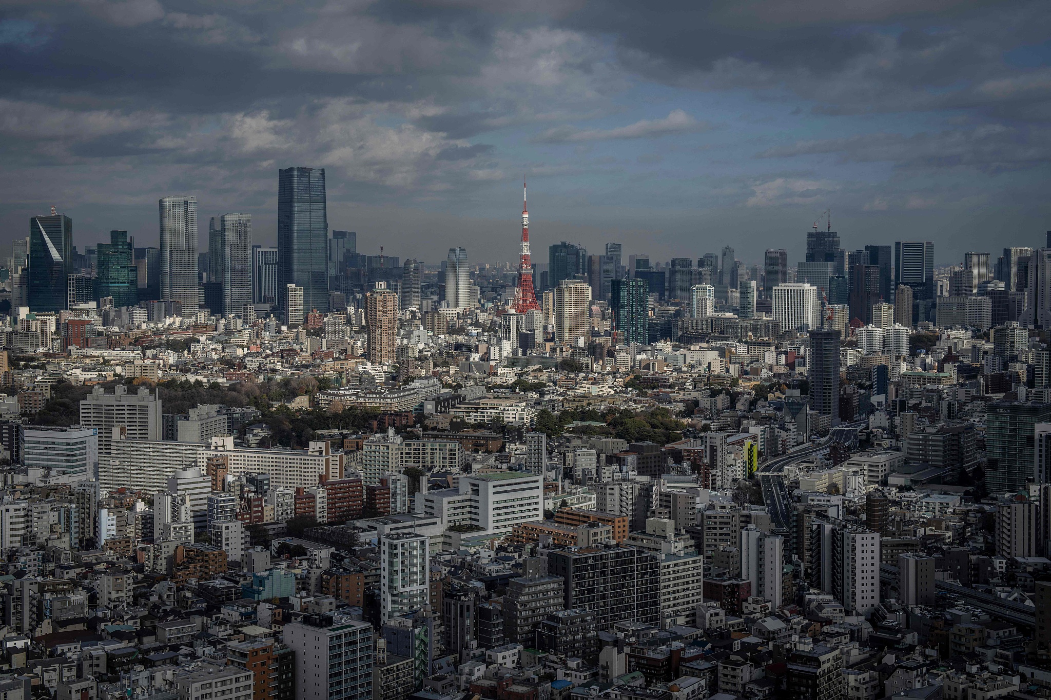 The city skyline is seen as the Tokyo Tower looms in the background in Tokyo, Japan, December 19, 2025. /VCG