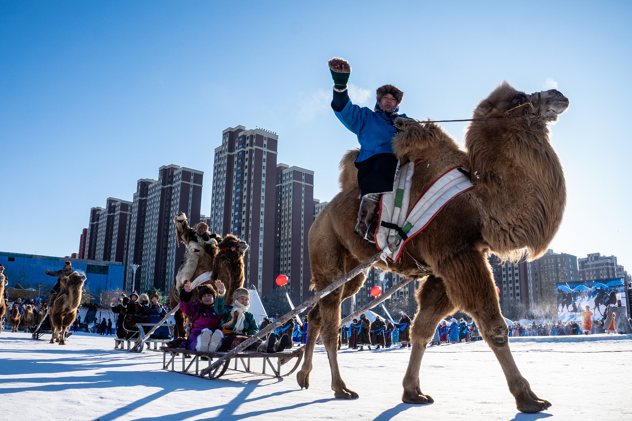 The performance team marches during the opening ceremony of the 21st Ice and Snow Naadam Fair of the Inner Mongolia Autonomous Region, in Hailar District of Hulun Buir, north China. /VCG