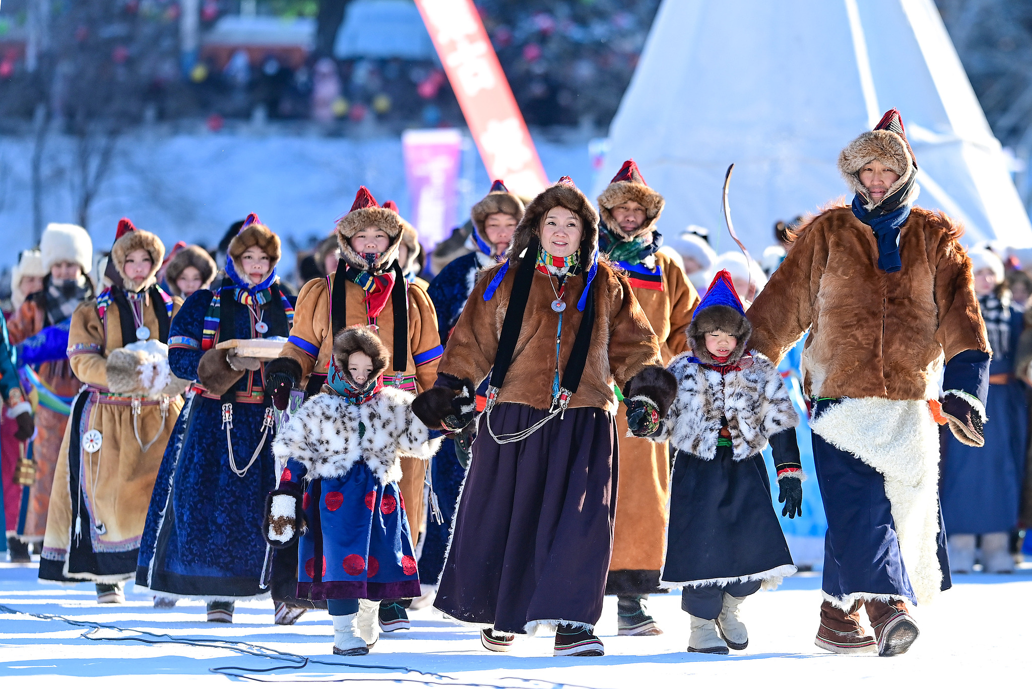 The performance team showcases ethnic costumes during the opening ceremony of the 21st Ice and Snow Naadam Fair of the Inner Mongolia Autonomous Region, in Hailar District of Hulun Buir, north China. /VCG