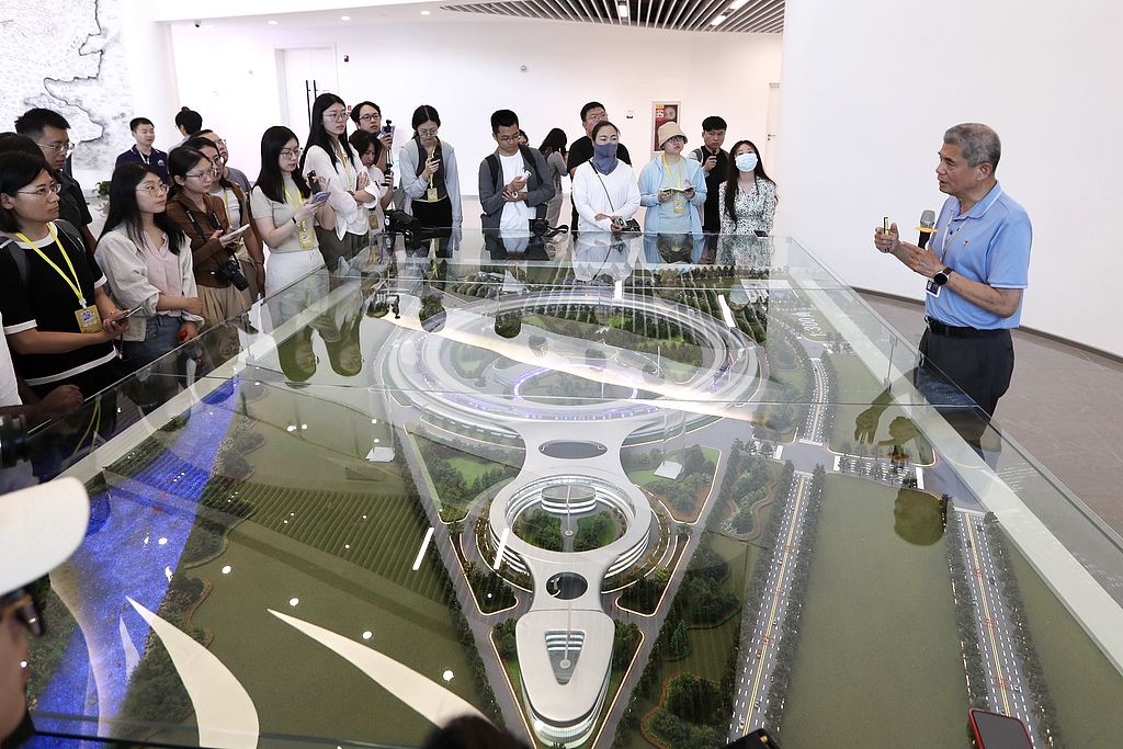 Visitors are briefed on a multimodal, cross-scale biomedical imaging facility at Huairou Science City in Beijing, China, June 18, 2025. /CFP