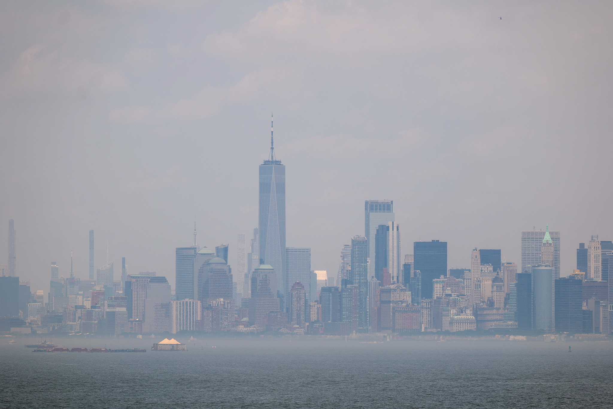 Manhattan is shrouded in an afternoon haze seen from Staten Island in New York, the U.S., June 23, 2025. /VCG
