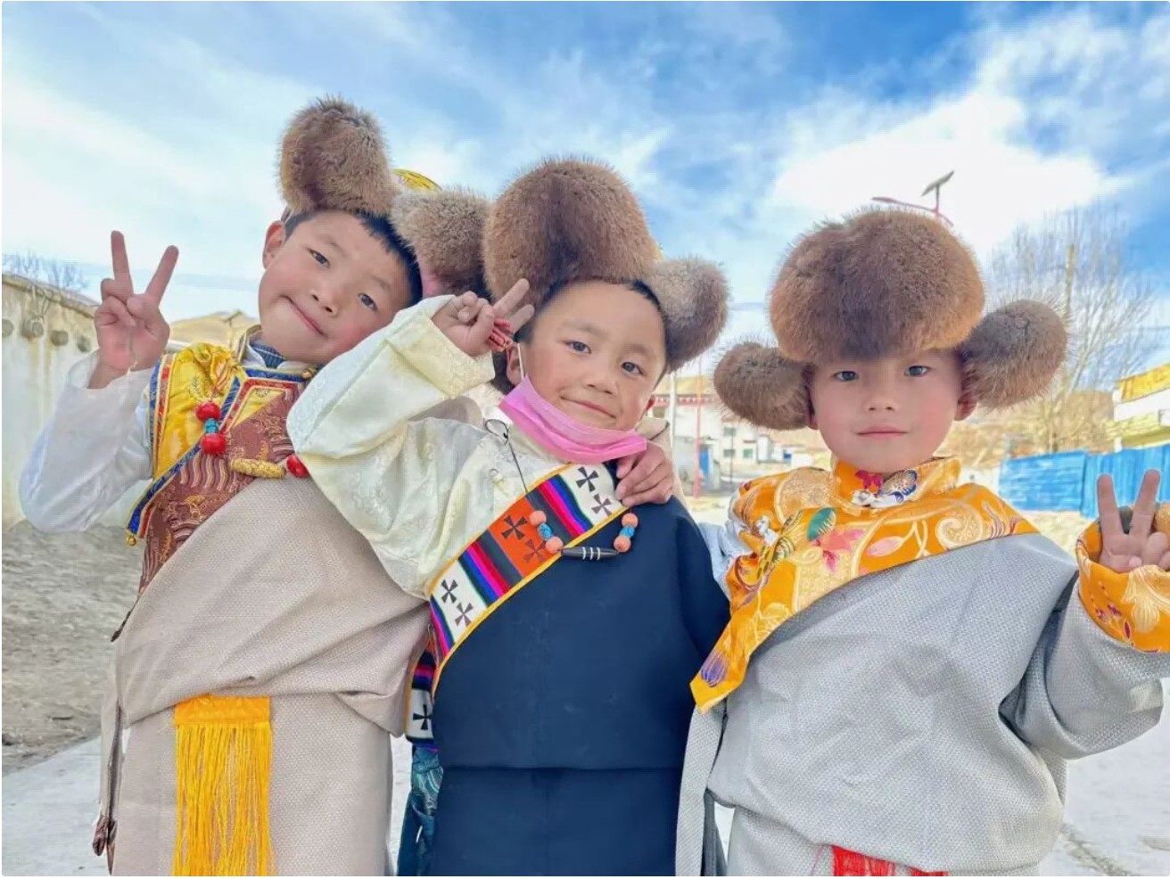 Children pose for photos during Pulan New Year in Pulan County, Xizang Autonomous Region. /CGTN
