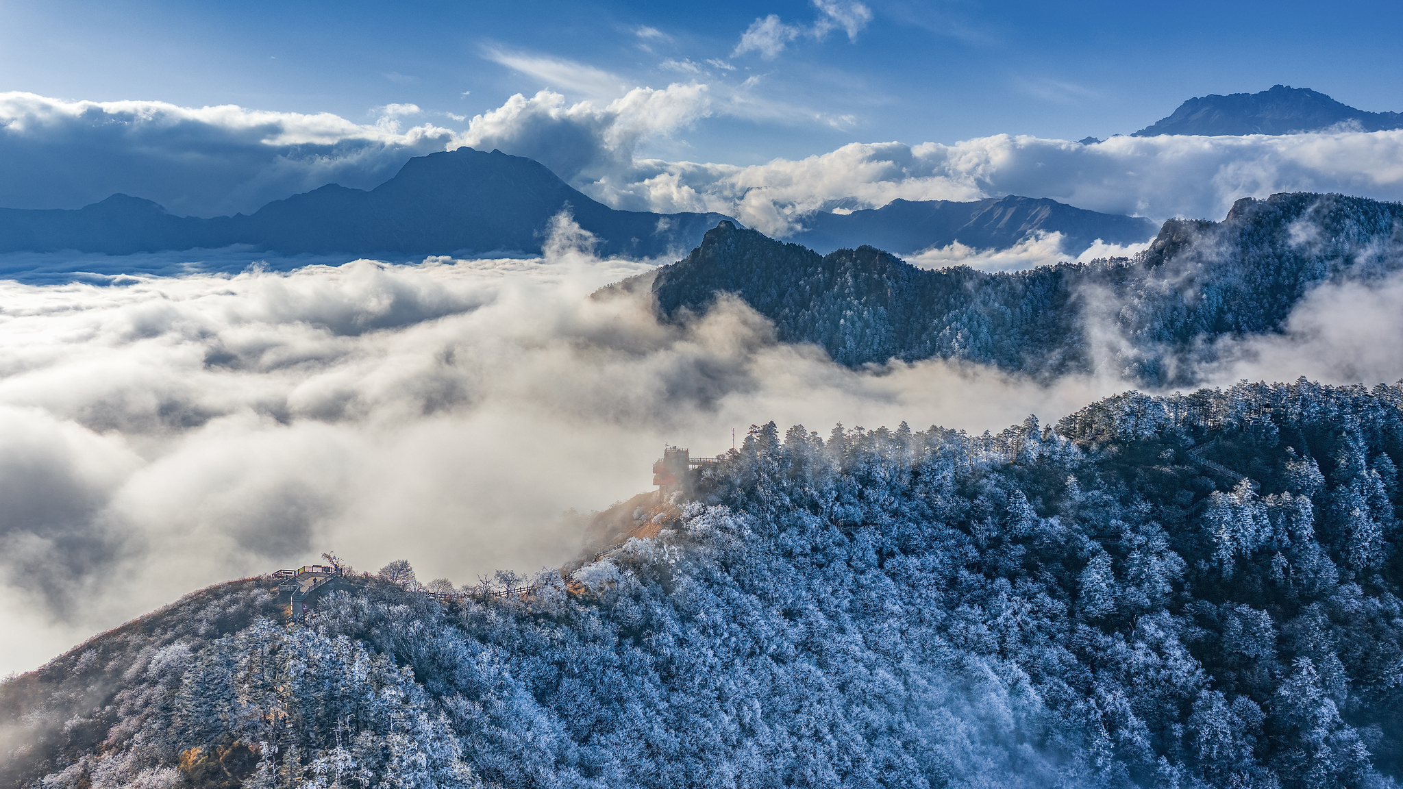 A bird's-eye view of Xiling Snow Mountain is captured in Chengdu, Sichuan Province on December 23, 2025. /VCG