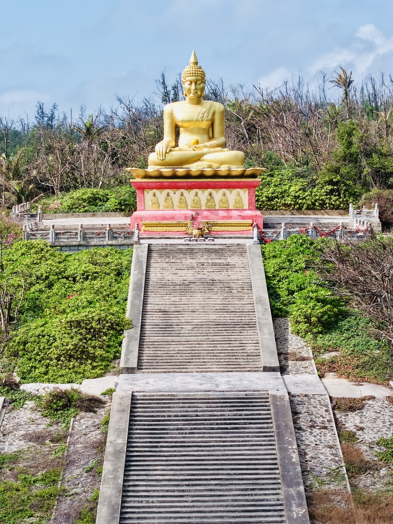 A 16-meter-tall statue of the Sakyamuni Buddha looks out to sea from the Foguang Temple in Wenchang, Hainan Province, China. /IC