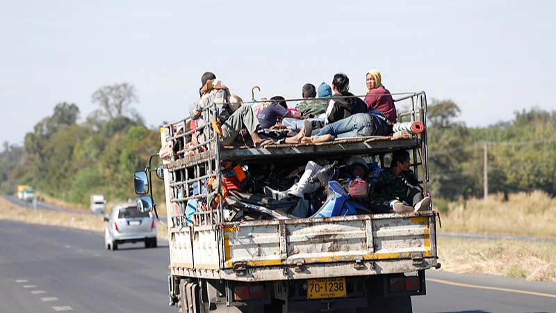 Displaced Thai villagers, carrying their belongings, travel on a truck as they evacuate during clashes between Thai and Cambodian troops in Si Sa Ket province, Thailand, December 12, 2025. /VCG
