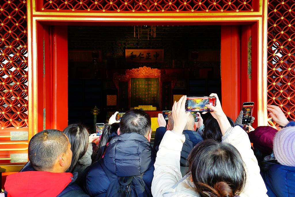 Visitors take pictures of the restored Hall of Mental Cultivation at the Palace Museum in Beijing, December 26, 2025. /VCG