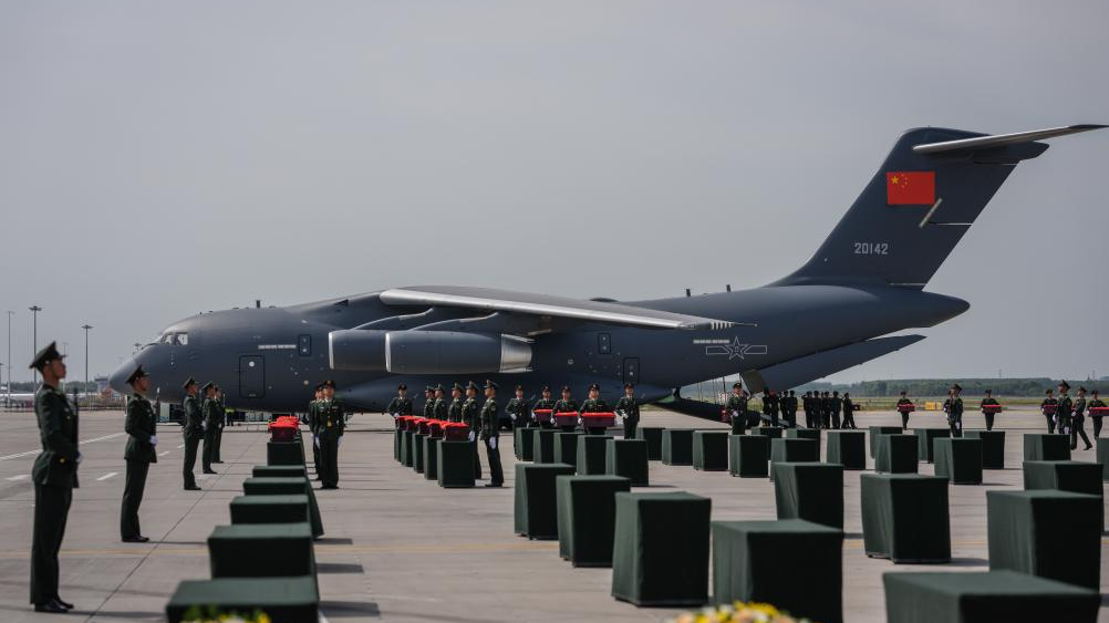 Soldiers escort coffins containing the remains of Chinese People's Volunteers (CPV) martyrs at Taoxian International Airport in Shenyang, northeast China's Liaoning Province, September 12, 2025. /Xinhua