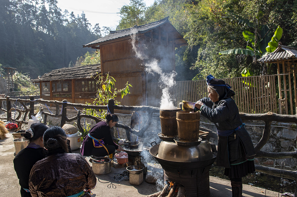 Dong ethnic villagers in Guizhou Province are busy making ciba on December 25, 2025. /VCG