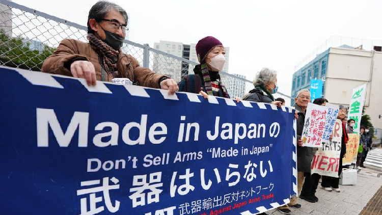 Japanese rally against ruling coalition's plan to ease arms export