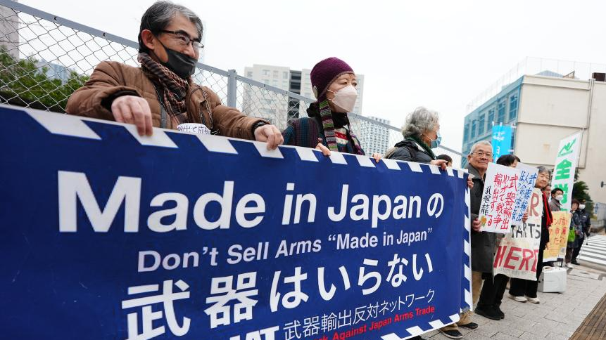 Protesters hold a rally in front of the headquarters of the Liberal Democratic Party, voicing strong opposition to a plan by the ruling coalition to relax restrictions on exports of weapons, in Tokyo, Japan, December 25, 2025. /Xinhua