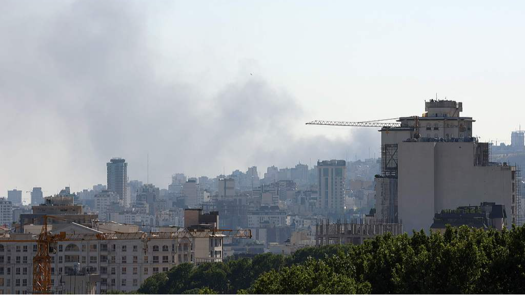 Smoke rises from the Islamic Republic of Iran Broadcasting Corporation building in the north of Tehran after it was hit by an overnight Israeli strike, June 17, 2025. /VCG