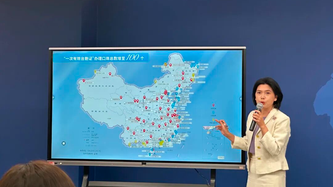State Council Taiwan Affairs Office spokesperson Zhu Fenglian speaks at a press briefing with a map of China displayed behind her. /State Council Taiwan Affairs Office