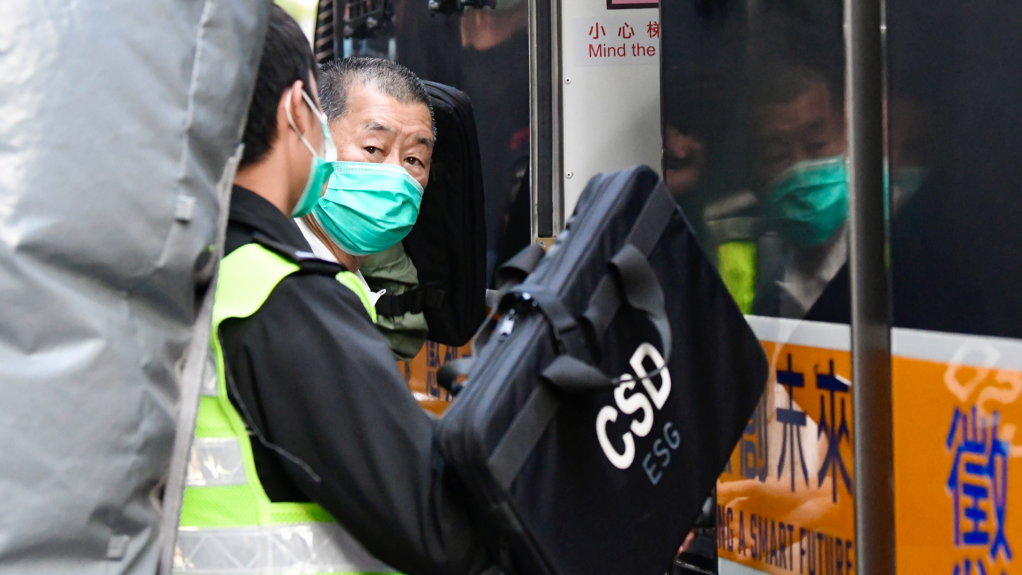 In this file photo, Jimmy Lai is escorted into a prison van by Correctional Services Department officers in Hong Kong Special Administrative Region, south China, February 1, 2021. /CFP
