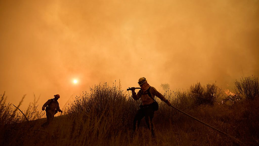 Firefighters battle a canyon fire in Castaic, California, U.S., August 7, 2025. /VCG