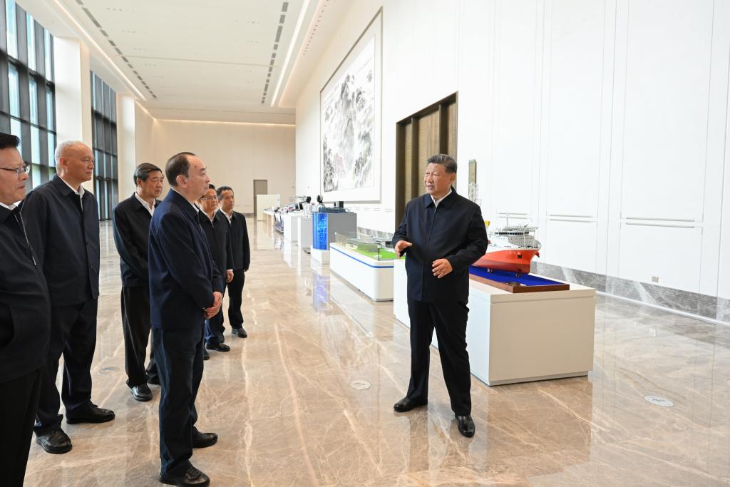 Chinese President Xi Jinping, also general secretary of the CPC Central Committee and chairman of the Central Military Commission, inspects the exhibition of Guangdong's achievements in the integrated development of technological and industrial innovation in Guangzhou, south China's Guangdong Province, November 8, 2025. /Xinhua