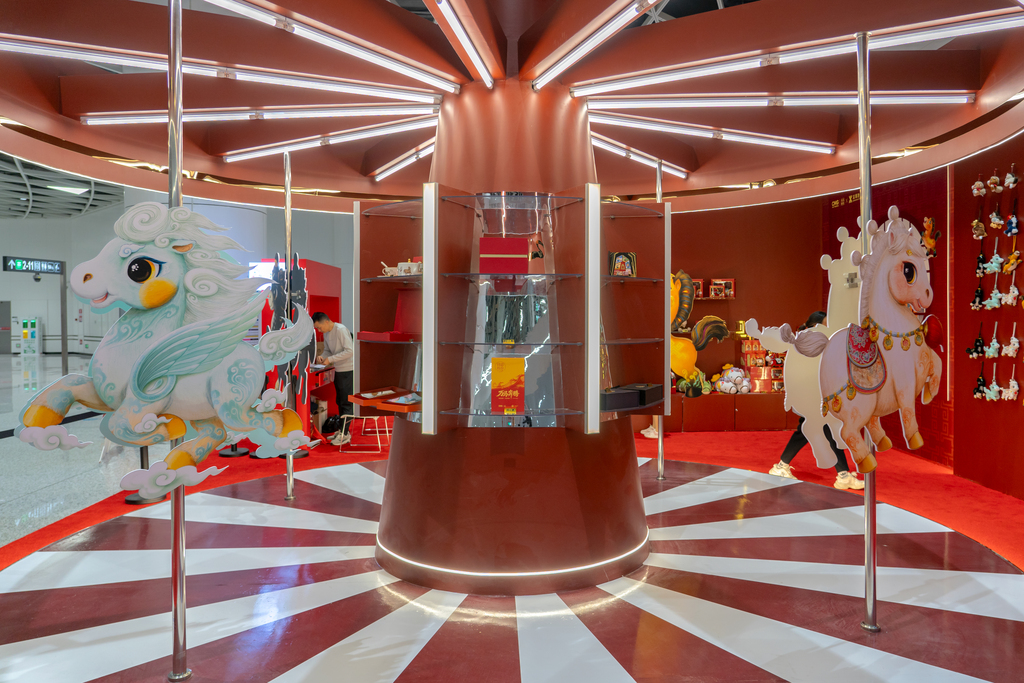 A cultural and creative store featuring the 2026 CMG Spring Festival Gala mascots for the Year of the Horse welcomes passengers at Gangxiabei Metro Station in Shenzhen, Guangdong Province, on December 27, 2025. /VCG