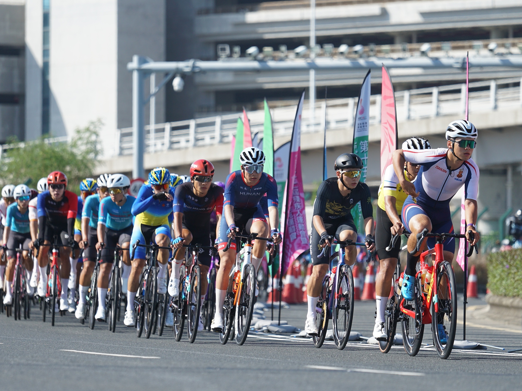 Riders participate in the men's cycling individual road race at China's 15th National Games in south China's Macao Special Administrative Region, November 8, 2025. /VCG