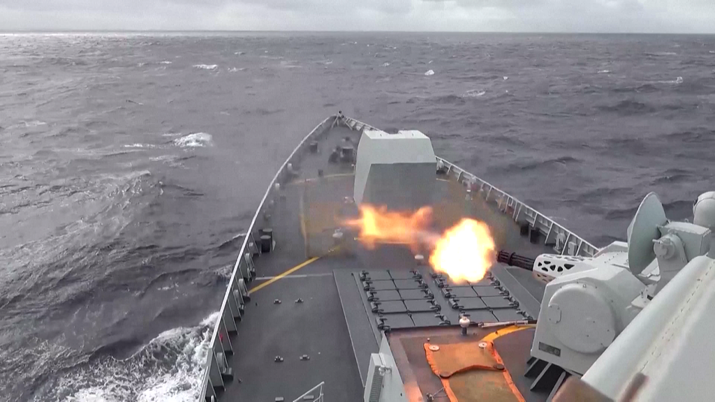 What triggered the PLA's military drills around Taiwan Island?