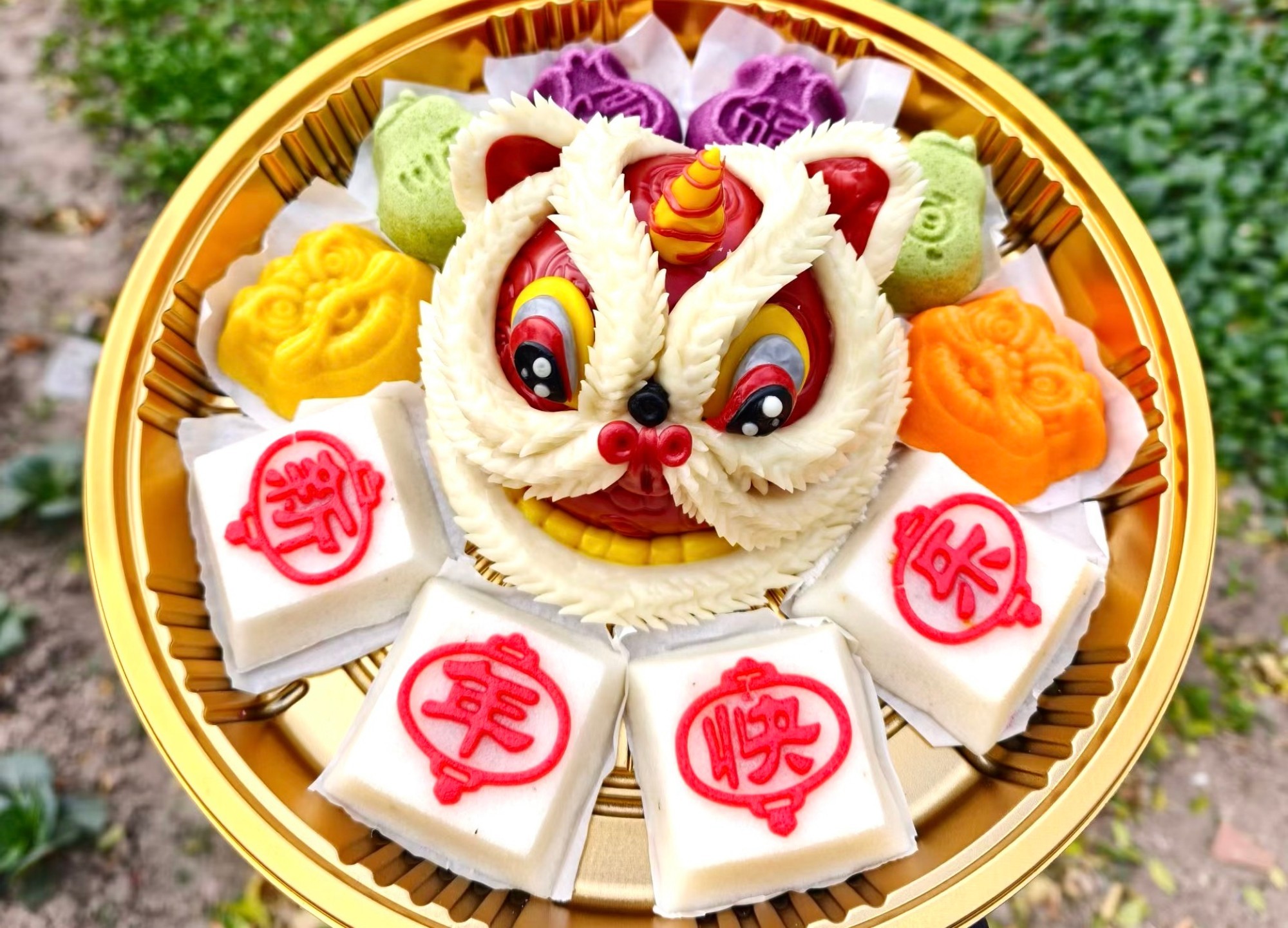 Handmade rice cakes shaped like ingots, peaches, persimmons and other auspicious symbols are seen on display at a village pastry shop in Changzhou, Jiangsu Province, December 31, 2025. /VCG