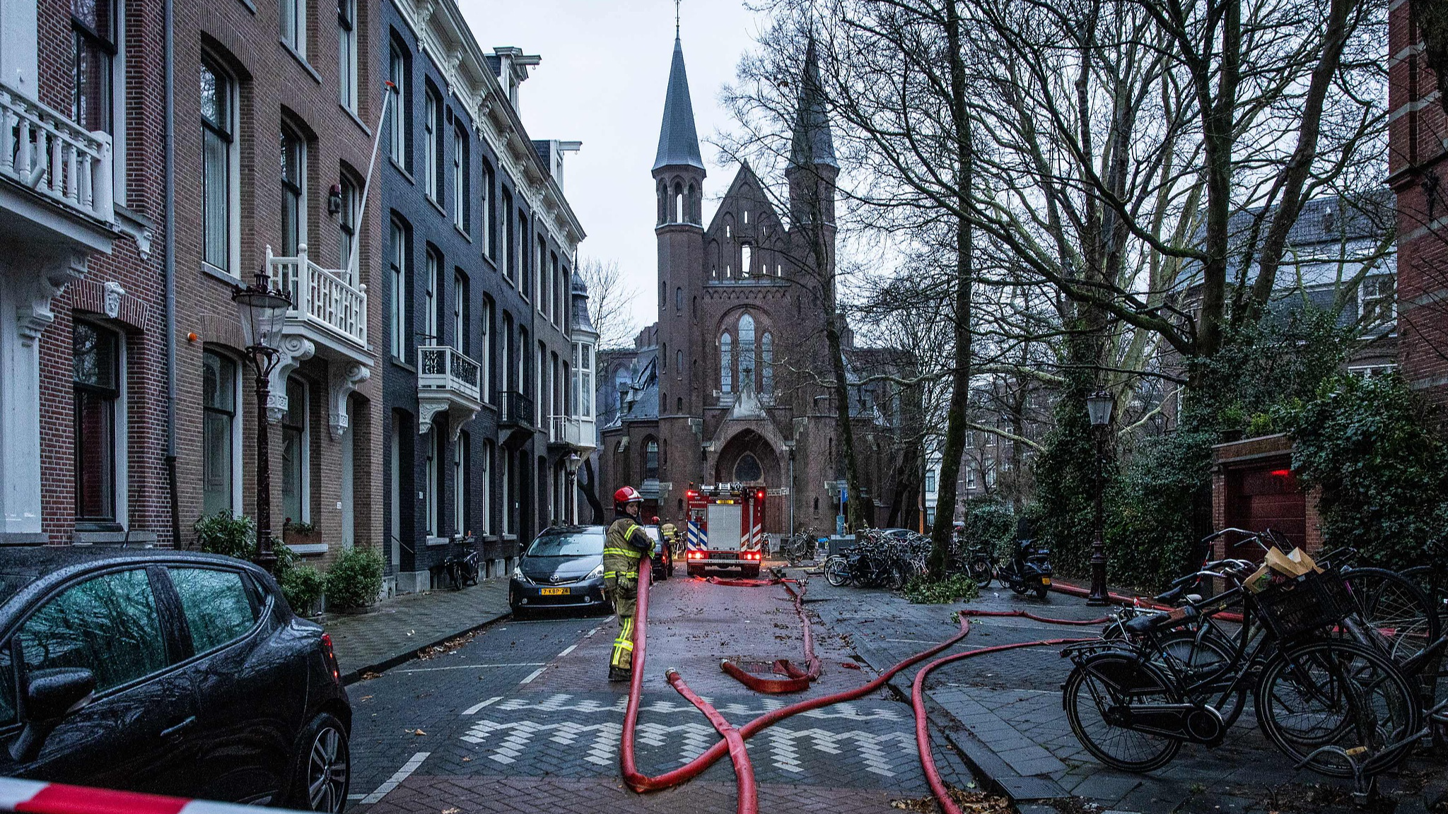 The image shows a firefighter's vehicle on the site of a fire that broke at the tower of the Vondelkerk church, during New Year's Eve, Amsterdam, January 1, 2026. /VCG