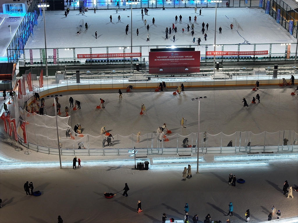 Visitors enjoy the multiple ice rinks throughout Harbin Ice and Snow World on December 31, 2025. /VCG