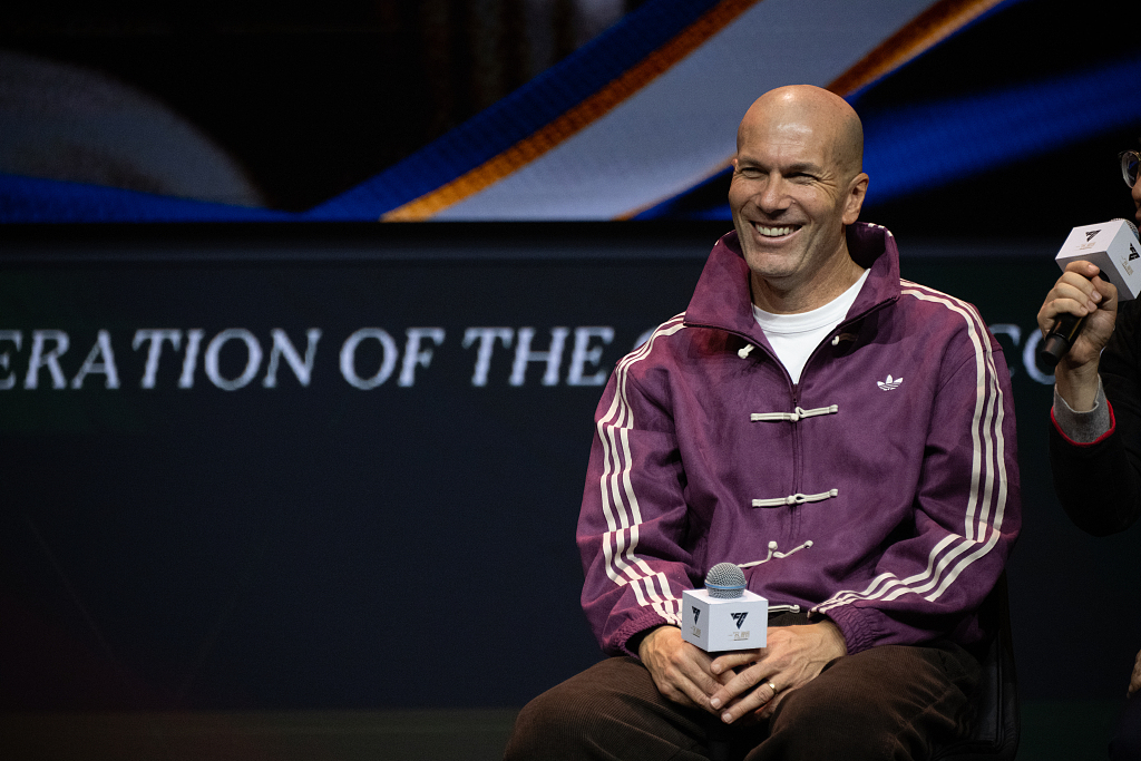 French football superstar Zinedine Zidane attends an event in Shanghai wearing a traditional Chinese-style frog closure top on November, 29, 2025. /VCG