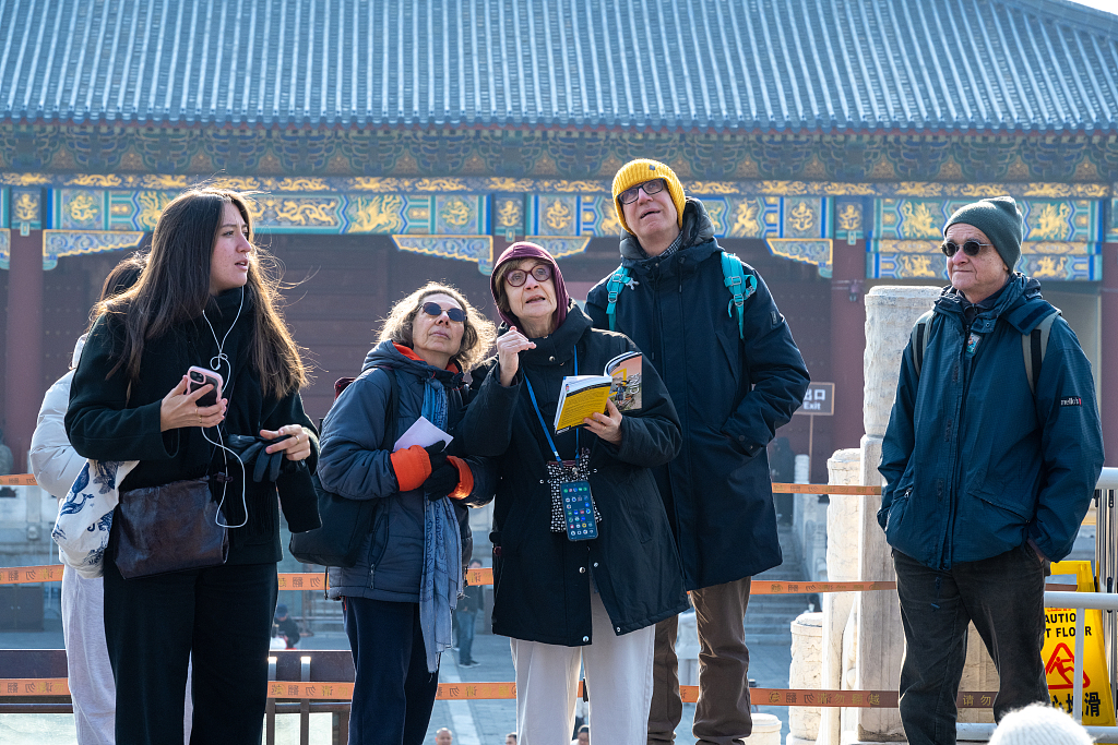 Foreign tourists visit the Temple of Heaven, Beijing, China, December 11, 2025. /VCG