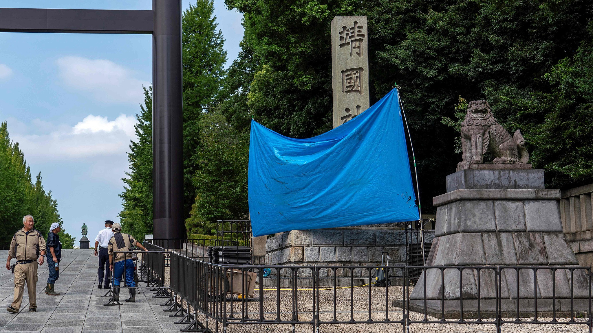 A blue sheet obscures the stone pillar which bears the name of the Yasukuni Shrine in Tokyo, Japan, August 19, 2024. /CFP