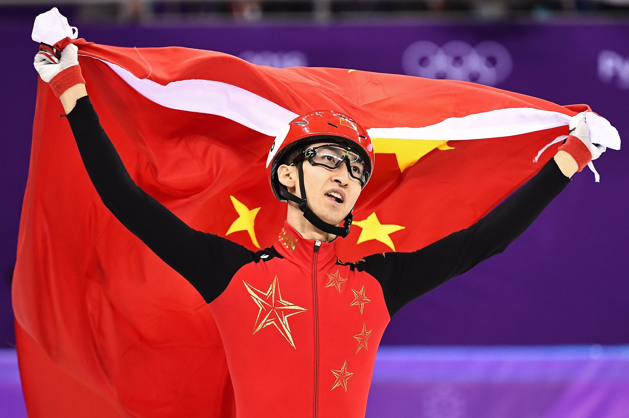 China's Wu Dajing celebrates after winning the men's 500m short track speed skating A final during the 2018 PyeongChang Winter Olympics at the Gangneung Ice Arena in Gangneung, Republic of Korea, February 22, 2018. /VCG