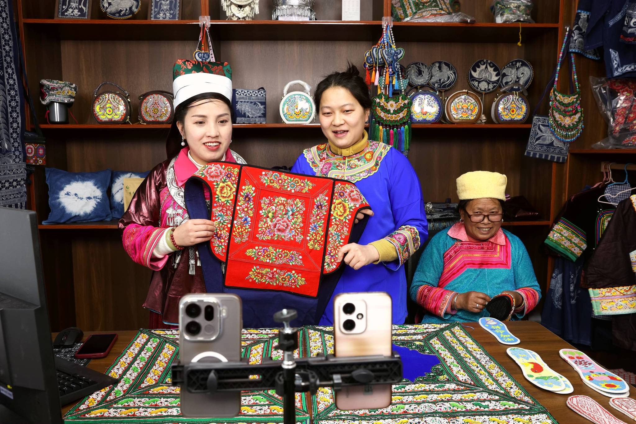 Live-streamers showcase ethnic embroidery products to online viewers in Rongjiang County, Qiandongnan Miao and Dong Autonomous Prefecture, in southwest China's Guizhou Province on January 7, 2026. /VCG