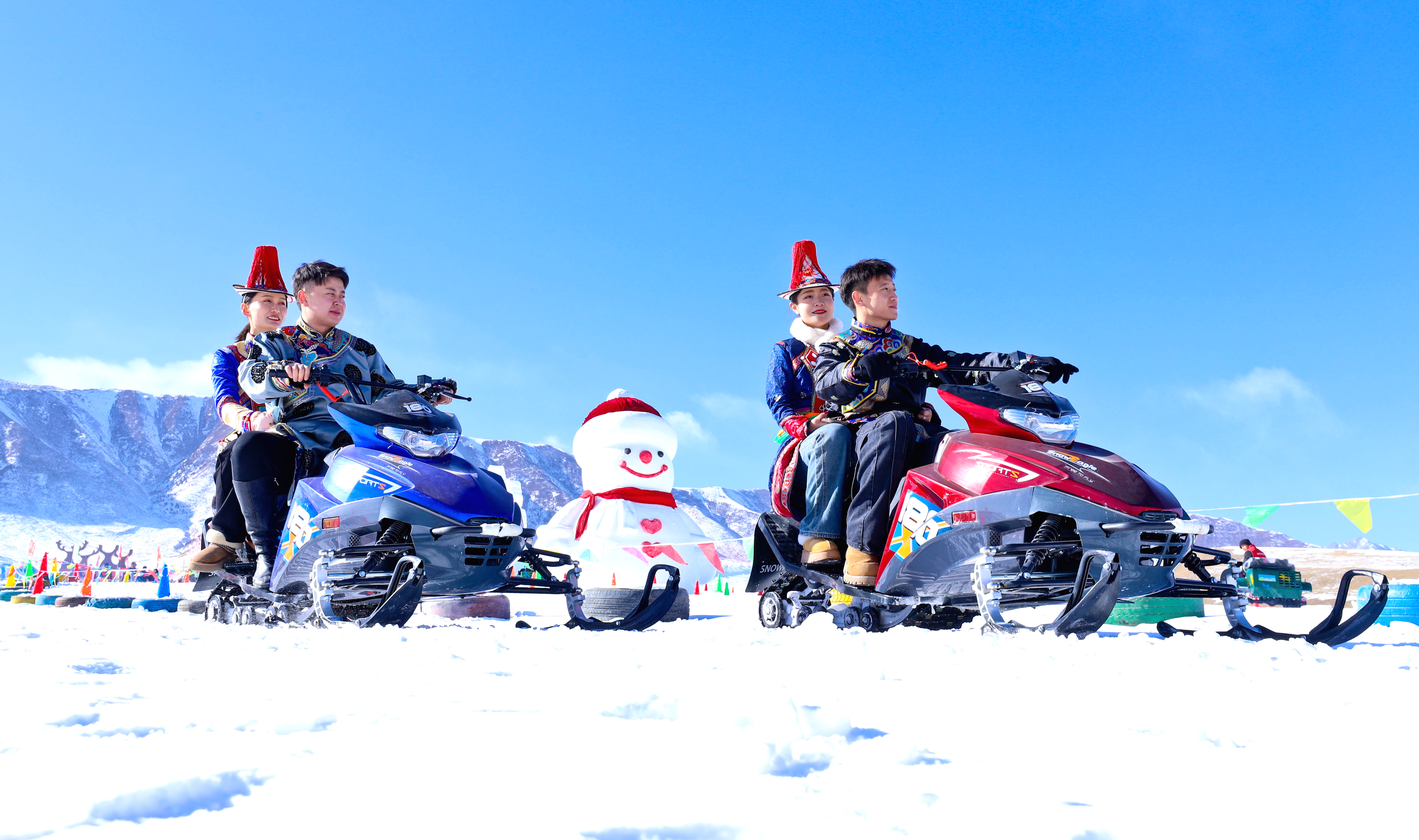 Visitors ride snowmobiles at Shenlu Park, at the foot of the Qilian Mountains in Zhangye, Gansu Province on January 9, 2026. /IC