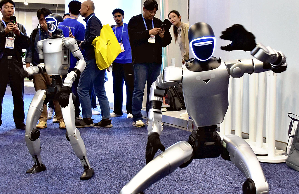 Unitree's humanoid robots are seen at the CES 2026, January 6, 2026. /VCG