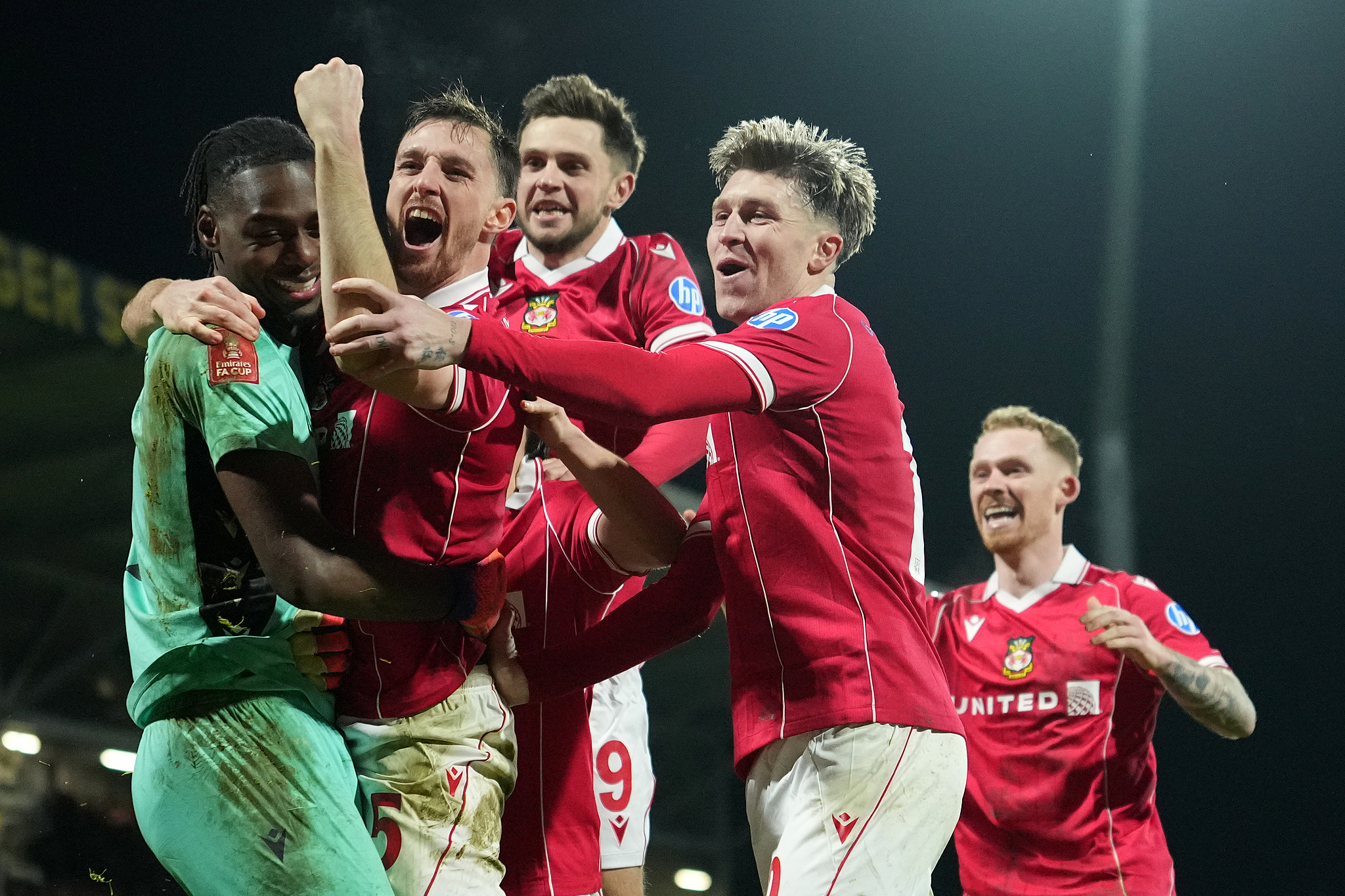 Wrexham's goalkeeper Arthur Okonkwo (L) celebrates with teammates after a penalty shootout at the end of the English FA Cup third round soccer match between Wrexham and Nottingham Forest in Wrexham, Wales, Janruary 9, 2026. /VCG