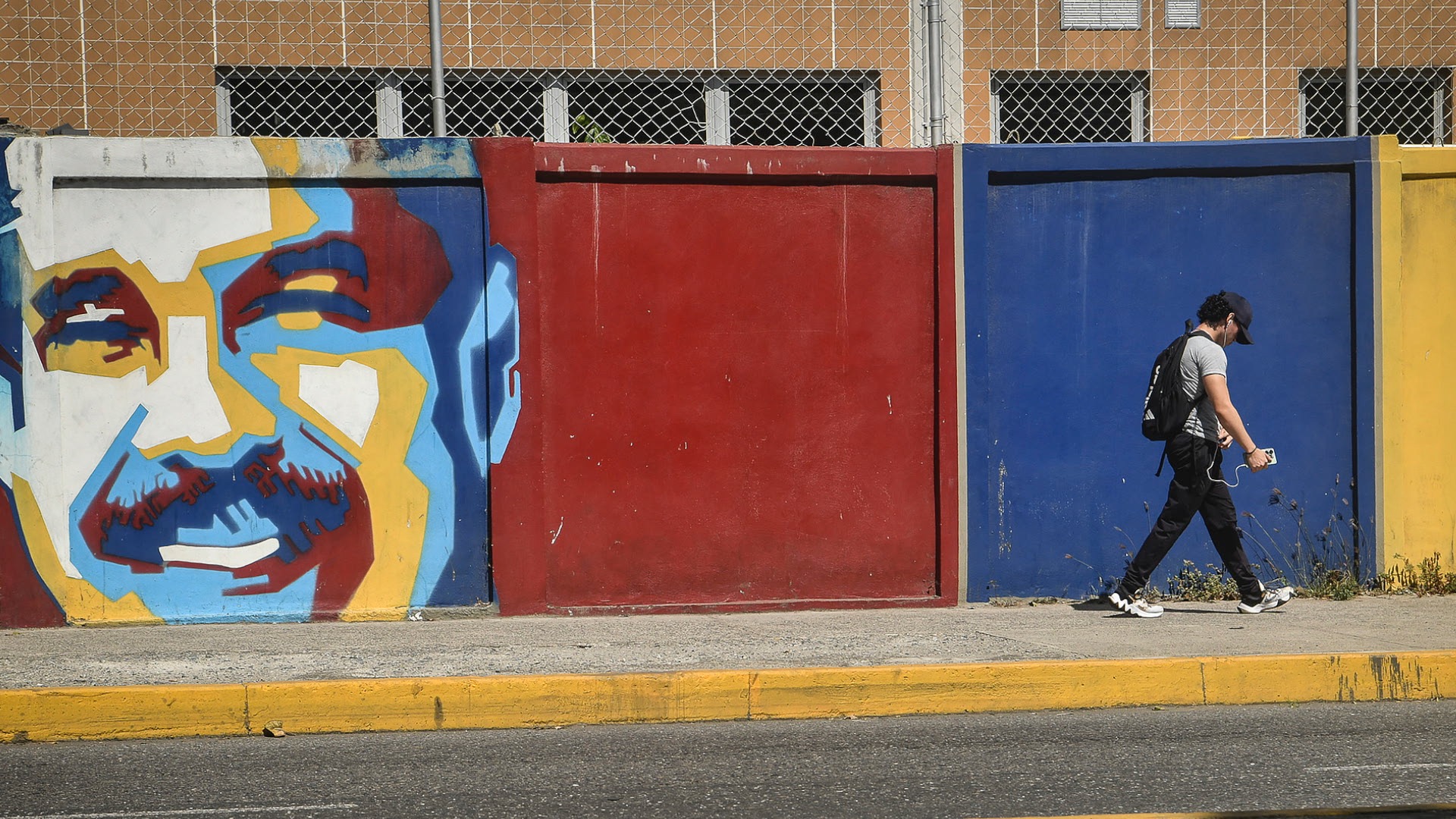 A man walks past a mural depicting Venezuelan President Nicolas Maduro in Caracas, Venezuela, on January 8, 2026. /VCG