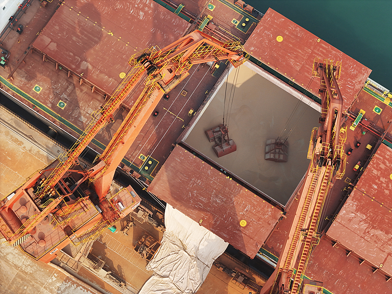 A crane unloads peas imported from Canada in Shandong Province, China, February 28, 2025. /CFP