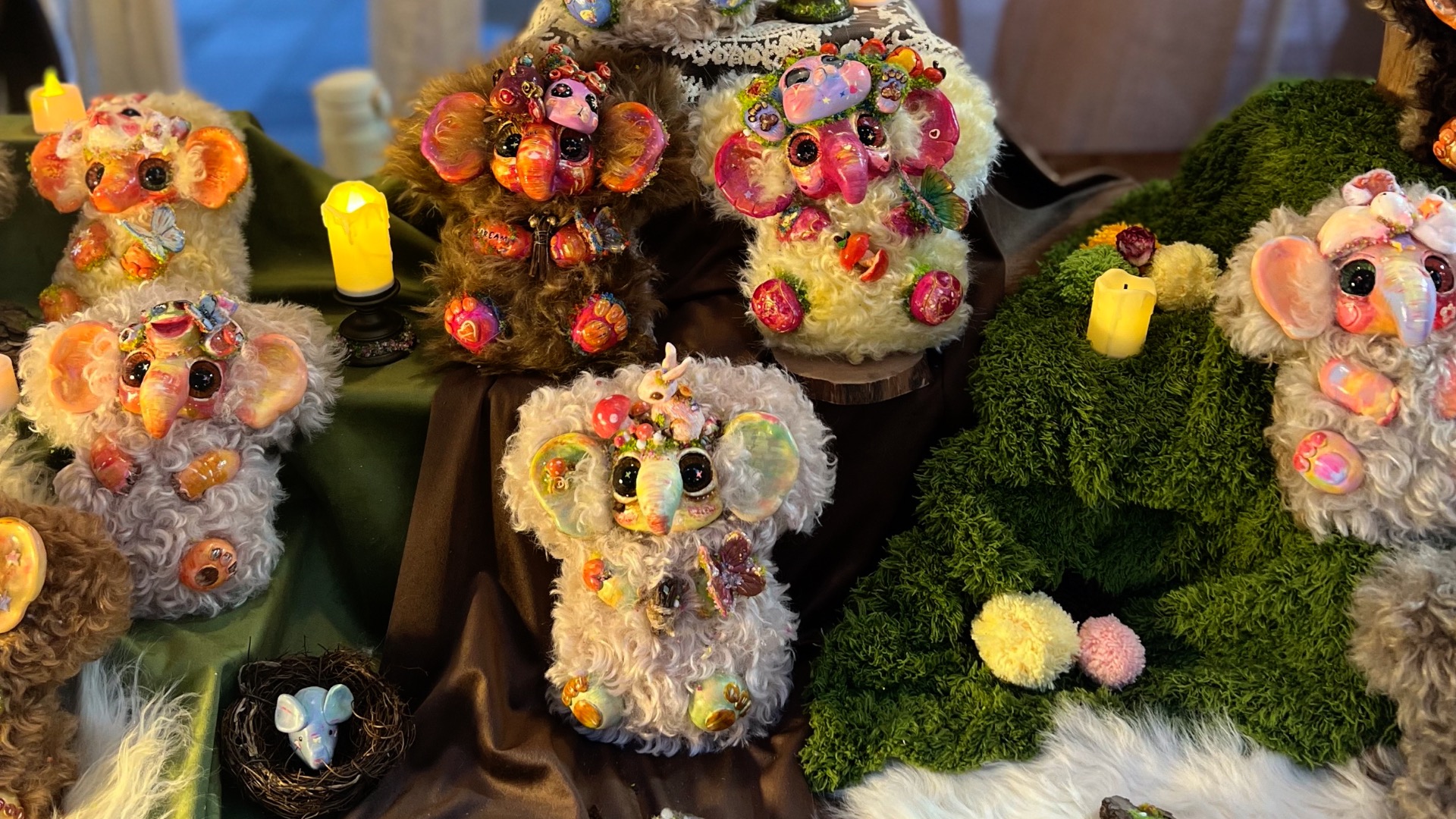 Designer Qi Yuting displays her CuriCure elephants. /CGTN