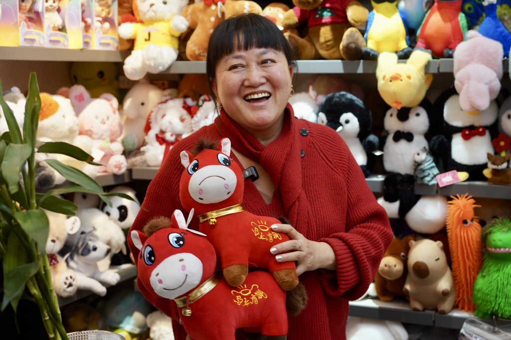 Toy manufacturer Zhang Huoqing shows off a 