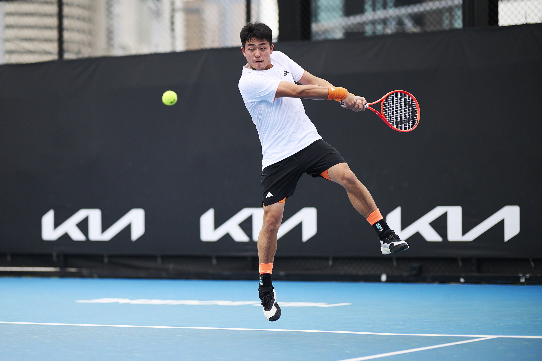 Wu Yibing of China hits a shot in the men's singles first-round match against Mitchell Krueger of the U.S. in the Australian Open qualifying tournament at Melbourne Park in Melbourne, Australia, January 13, 2026. /VCG