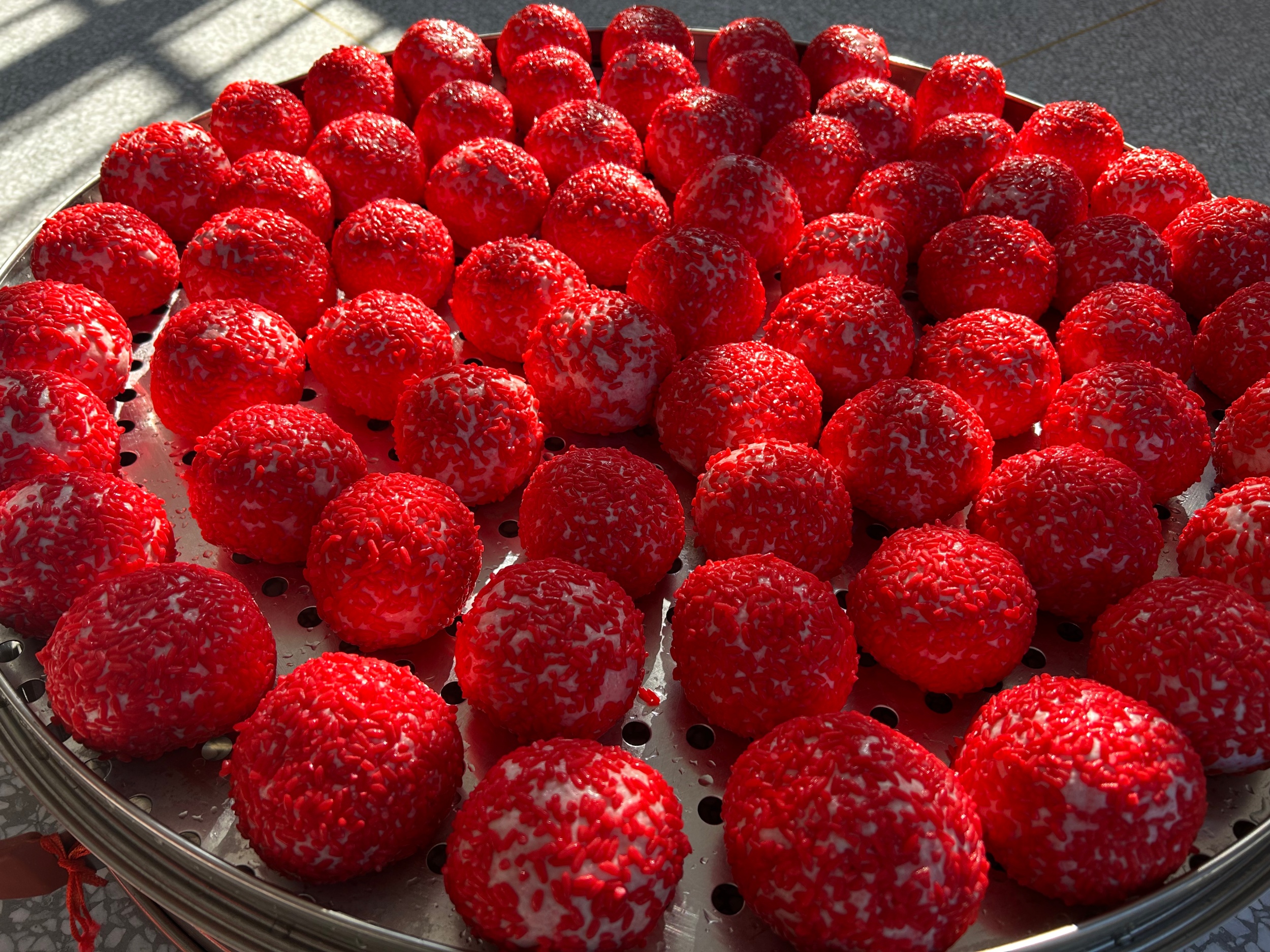 Red rice cakes are seen in Wengbei Village, Tongren City, southwest China's Guizhou Province, on January 8, 2026. /Tongren Media Convergence Center