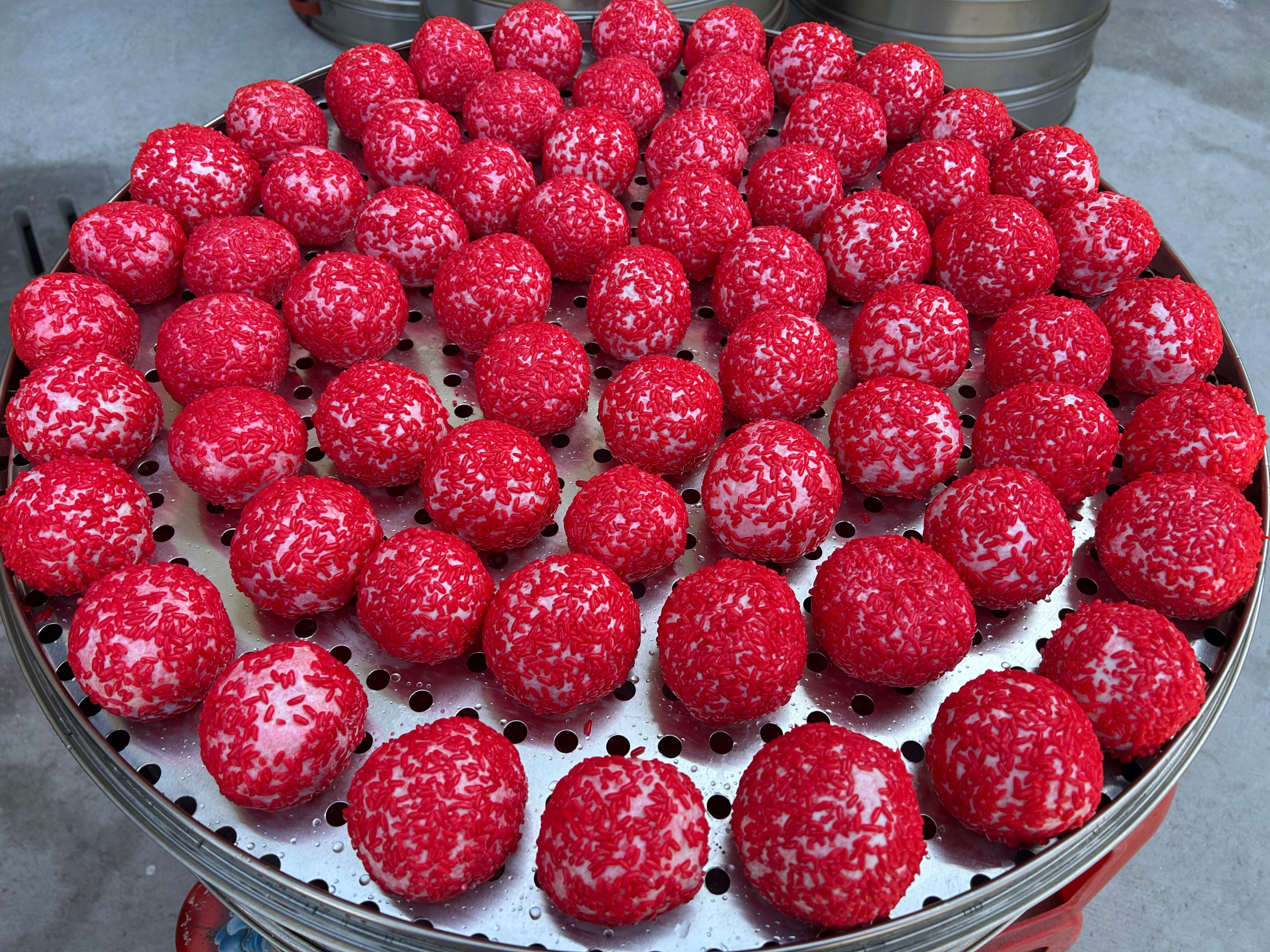 Red rice cakes are seen in Wengbei Village, Tongren City, southwest China's Guizhou Province, on January 8, 2026. /Tongren Media Convergence Center